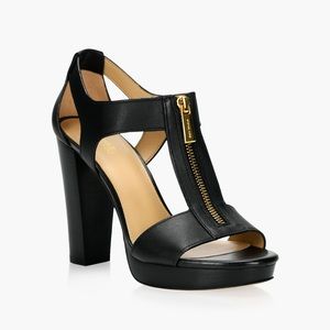 Michael Kors zip up black heels.